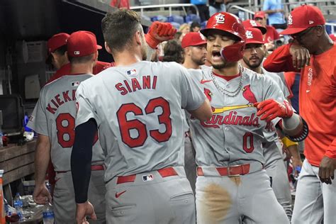 WInn’s homer in 12th, Carlson’s throw lead Cardinals over Marlins for 1.